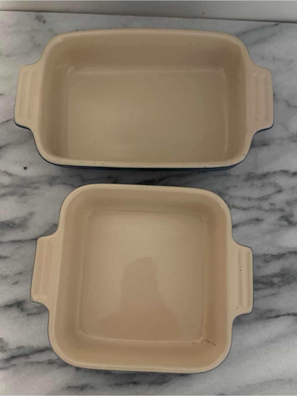 Le Creuset Cream Ceramic Baking Dishes with Blue Rim - Set of 2